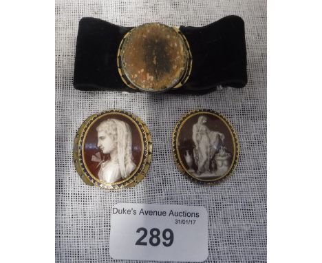 A PAIR OF EARLY 19TH CENTURY PENDANT CLASPS painted on copper within gilt and enamel borders, with a profile of a woman and d