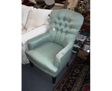 A VICTORIAN STYLE BUTTON-BACK ARMCHAIR with turned legs