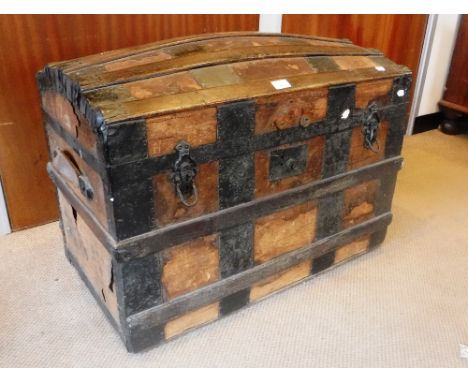 A 19TH CENTURY WOODEN AND METAL BOUND DOME TOP TRUNK 30.5" wide