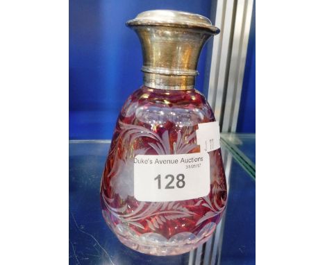 A RED OVERLAID CUT-GLASS SILVER-TOPPED SCENT FLASK