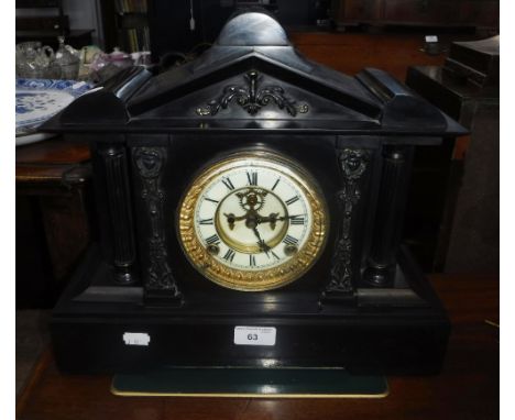A 19TH CENTURY SLATE CASED MANTEL CLOCK OF ARCHITECTURAL FORM with visible escapement (key in office)