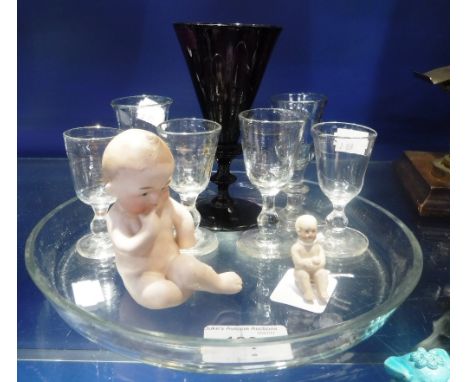 A COLLECTION OF 19TH CENTURY SMALL DRINKING GLASSES, an 'amethyst' glass wine glass and two ceramic baby ornaments