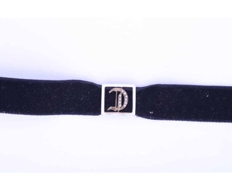 ENAMEL AND PEARL SET BRACELET
formed of a rectangular enamel and pearl set buckle with the letter D in the centre, enamelled 