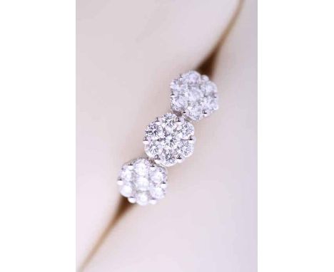 PRETTY DIAMOND CLUSTER RING
set with three flower shaped clusters of brilliant cut diamonds, in eighteen carat white gold, si