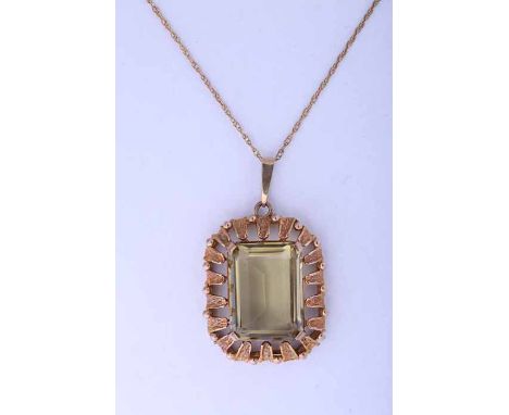 LARGE NINE CARAT GOLD CITRINE FOB
the emerald cut citrine measuring approximately 20mm x 15mm, in unmarked setting, on a nine