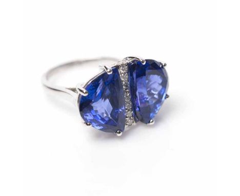 IMPRESSIVE TANZANITE AND DIAMOND DRESS RING
set with two faceted tanzanites totalling approximately 16.63 carats, in diamond 
