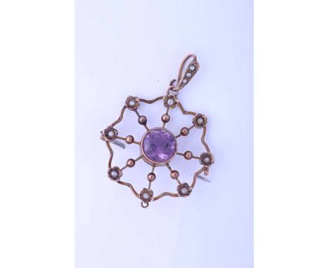 EDWARDIAN AMETHYST AND SEED PEARL HOLBEIN 
of scrolling openwork form, with a central oval amethyst surrounded by seed pearls
