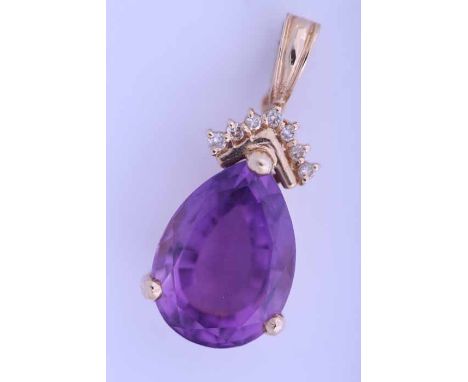 LARGE AMETHYST AND DIAMOND PENDANT
the pear shaped amethyst measuring approximately 17mm x 12.8mm, in fourteen carat yellow g