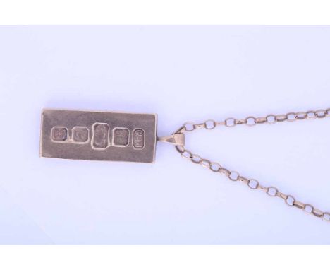 NINE CARAT GOLD INGOT PENDANT
on a nine carat gold chain, 41.5g