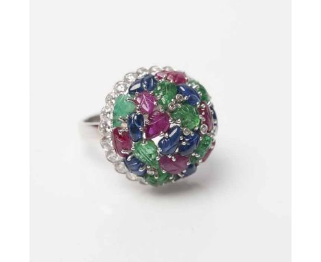 SAPPHIRE, EMERALD, RUBY AND DIAMOND CLUSTER RING
the emeralds, rubies and sapphires carved as leaves, with a surround of bril