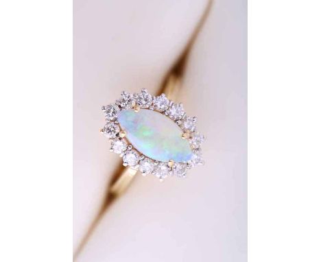 OPAL AND DIAMOND CLUSTER RING
with a central marquise cabochon opal, surrounded by a row of brilliant cut diamonds, in eighte