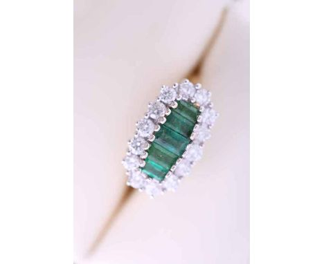 EMERALD AND DIAMOND CLUSTER RING
set with five graduated rectangular emeralds, surrounded by a row brilliant cut diamonds, in