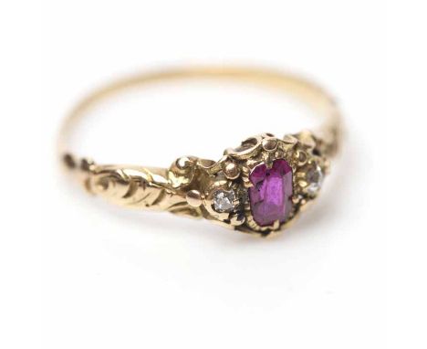 VICTORIAN RUBY AND DIAMOND RING
in ornate foliate setting, set centrally with an oval ruby, flanked by two rose cut diamonds,