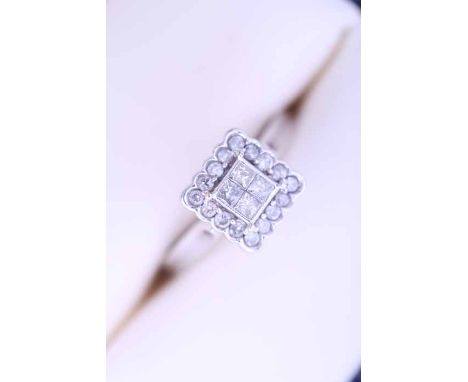 DIAMOND CLUSTER RING
the square bezel set with four faceted diamonds, surrounded by a row of brilliant cut diamonds, in diamo