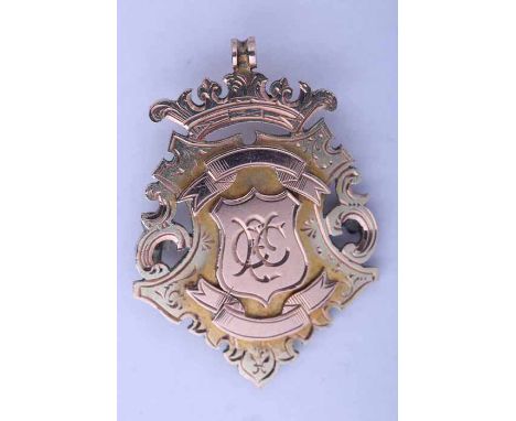 VICTORIAN NINE CARAT GOLD MEDAL FOB
with presentation inscription verso 'Stirlingshire 2nd XI F.A. 1892-93 won by M. Burns', 