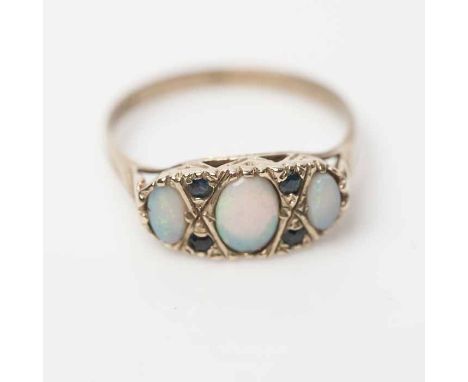 VICTORIAN OPAL AND SAPPHIRE RING
set with three cabochon opals, interspersed with sapphires, hallmarked nine carat gold, size