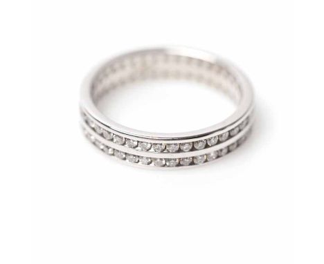 DIAMOND FULL ETERNITY RING
channel set with two rows of brilliant cut diamonds, in eighteen carat gold, size M-N