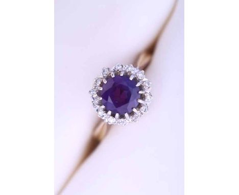 AMETHYST AND DIAMOND CLUSTER RING
with a central round cut diamond surrounded by diamonds, in nine carat gold, size K