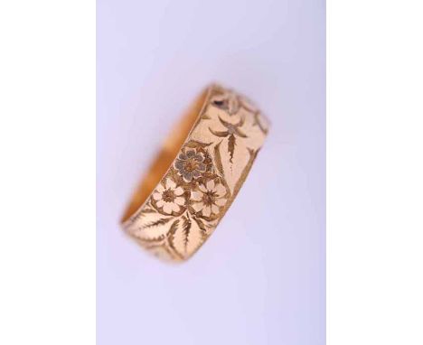 EIGHTEEN CARAT GOLD WEDDING BAND
engraved with floral decoration, bearing full hallmarks, size R-S, 7.8gms