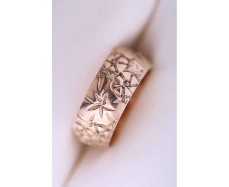 NINE CARAT GOLD WEDDING BAND
engraved with floral decoration, bearing full hallmarks, size M-N, 5.9gms