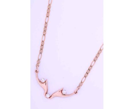 UNUSUAL NINE CARAT GOLD DIAMOND ANTLER MOTIF PENDANT
set with brilliant cut diamonds, on a nine carat gold chain