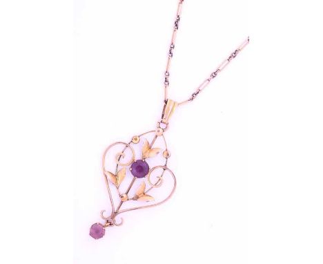 EDWARDIAN AMETHYST PENDANT
of openwork form, set with two round amethysts, on a chain, together with another gold chain