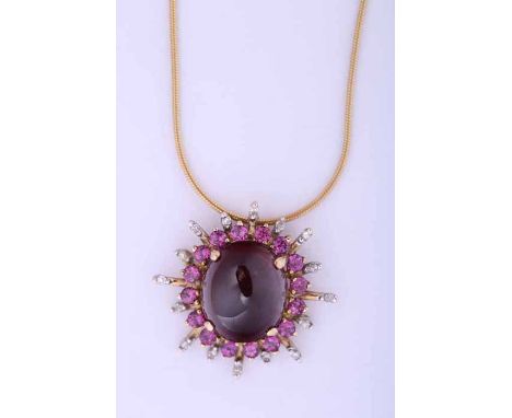 UNUSUAL MULTI GEM SET DIAMOND CLUSTER PENDANT
set centrally with a large cabochon garnet measuring approximately 11.99mm x 10