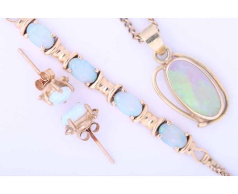 COLLECTION OF OPAL SET JEWELLERY
comprising of a pair of opal earrings, a fourteen carat gold opal pendant and a nine carat g