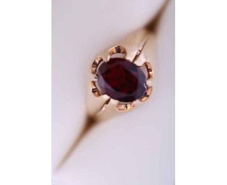 GENTLEMAN'S NINE CARAT GOLD GARNET SET DRESS RING
of pierced form, hallmarked nine carat gold, size R