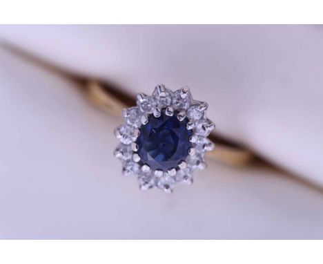 SAPPHIRE AND DIAMOND CLUSTER RING
the oval sapphire approximately 1.10 carats, in a surround of brilliant cut diamonds, in ei