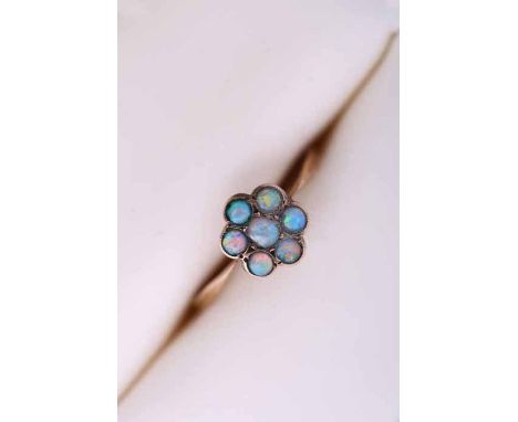 PRETTY OPAL CLUSTER RING
of floral form, set with seven cabochon opals, in nine carat gold, size L