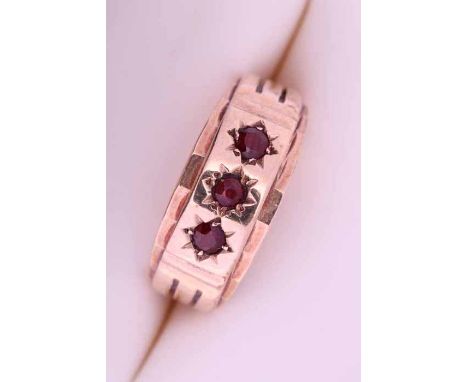 NINE CARAT GOLD VICTORIAN STYLE GARNET RING
star set with three round garnets, hallmarked nine carat gold, size Q-R, 7.1gms