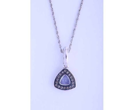 TANZANITE AND DIAMOND PENDANT
set with a trillion cut tanzanite, surrounded by brilliant cut diamonds, in nine carat white go