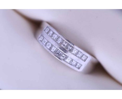 EIGHTEEN CARAT GOLD DIAMOND SET BAND
channel set with two rows of square cut diamonds totalling approximately 0.75 carats, in