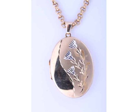 NINE CARAT GOLD LOCKET
the oval locket with engraved floral decoration, on a nine carat gold chain, 15.6gms gross