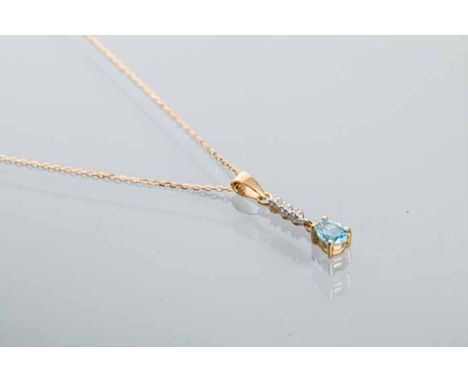 TOPAZ AND DIAMOND PENDANT
with a pear shaped blue topaz below a row of diamonds, marked 375 for nine carat gold, on a chain