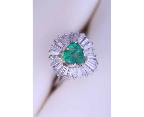 HEART SHAPED EMERALD AND DIAMOND CLUSTER RING
the central heart shaped emerald approximately 1.08 carats, surrounded by bague