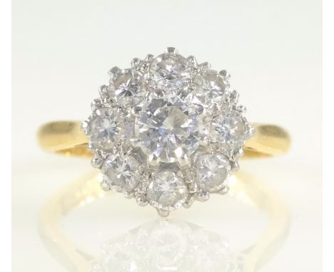 Diamond cluster ring stamped 18ct plat   Condition Report  central diamond approx 5mm diameter approx 3.6gm size K-L Click he