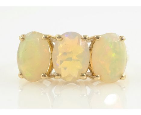 Three stone opal gold ring hallmarked 9ct   Condition Report  Approx 2.3gm size L-M Click here for further images, condition,