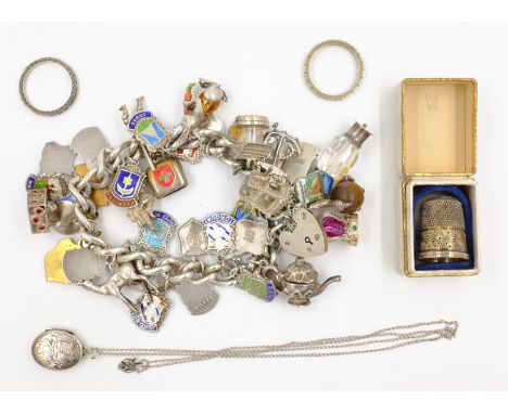 Heavy silver curb chain bracelet each link hallmarked hung with enamel souvenir, Peter Rabbit and other other charms, thimble