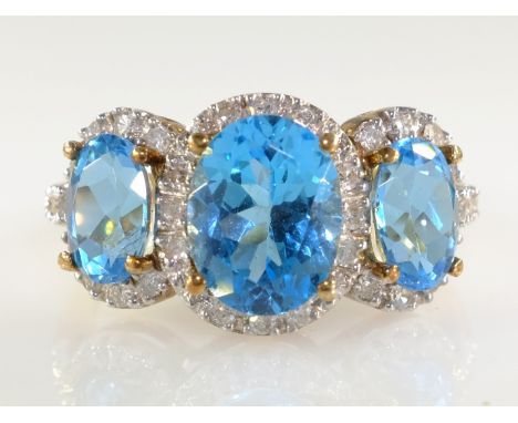 Gold three stone topaz and diamond cluster ring hallmarked 9ct   Condition Report  Approx 3.8gm size = N Click here for furth