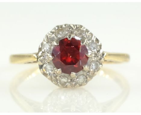 Garnet and diamond cluster ring hallmarked 9ct   Condition Report  Approx 2.6gm size K-L Click here for further images, condi