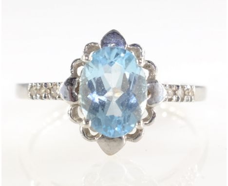 White gold oval aquamarine and diamond ring hallmarked 9ct   Condition Report  Approx 1.9gm size M-N Click here for further i