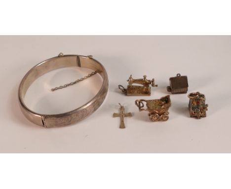 Silver bangle and five silver charms, 36.5g.