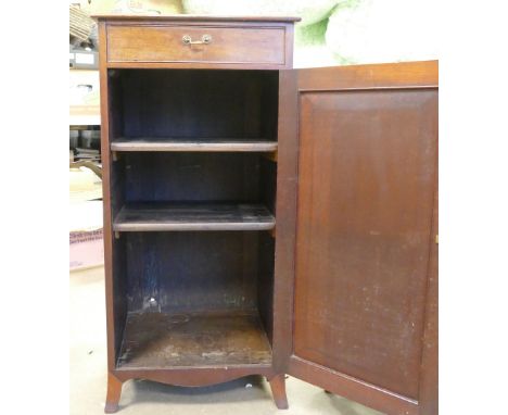 Victorian Music Cabinet. One small upper drawers with pull handle above a large door with rococo escutcheon revealing three i