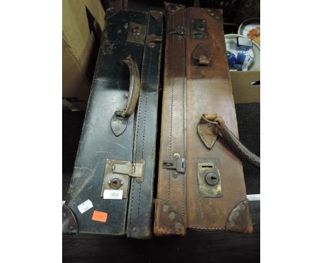 Two vintage leather bound suitcases or travel trunks