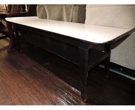 A vintage formica topped coffee table