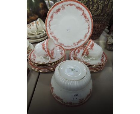 A part tea service with red transfer printed decoration