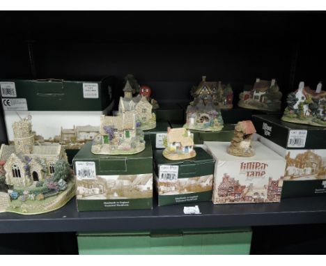 A shelf of Liliput Lane studies including Lead Kindly Light, Burnham Thorpe Rectory, Whisky Galore etc, all boxed