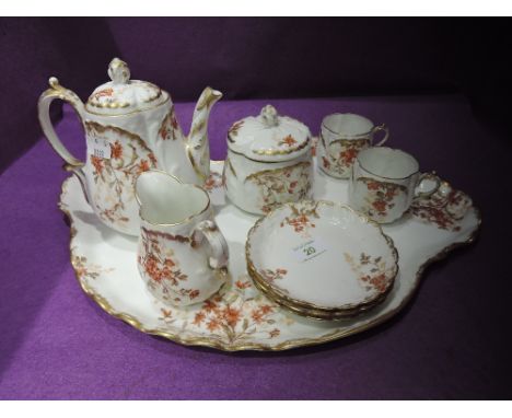 A vintage ceramic tea for one service by Limoges FranceCONDITION REPORTOne cup has hairline crackSugar bowl has hairline crac